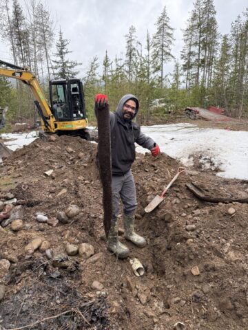 Plumber removing a severe sewer line clog during drain cleaning service in Kalispell Montana