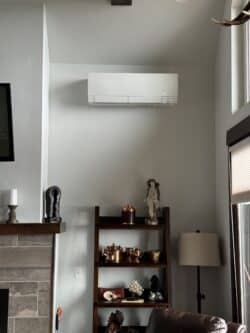 Wild West Plumbing technician installing ductless heat pump system in Whitefish, MT