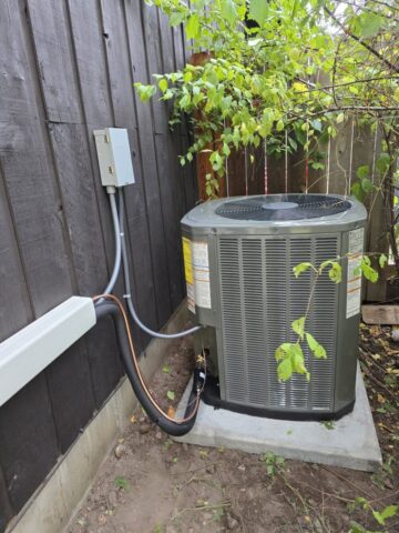 Outdoor air conditioning unit installed by licensed HVAC technician in Whitefish Montana